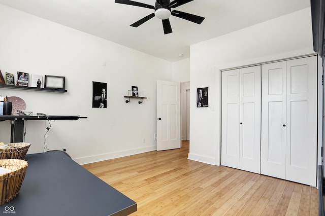 1209 N Rural St, Indianapolis, IN 46201 - workout area with light wood-type flooring, baseboards, and ceiling fan