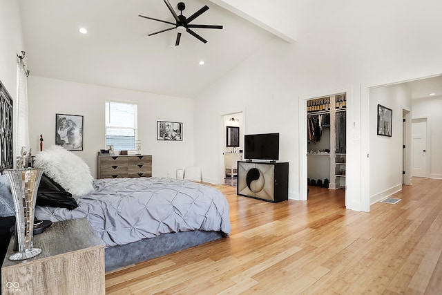 1209 N Rural St, Indianapolis, IN 46201 - bedroom featuring visible vents, baseboards, light wood-style flooring, a spacious closet, and beamed ceiling
