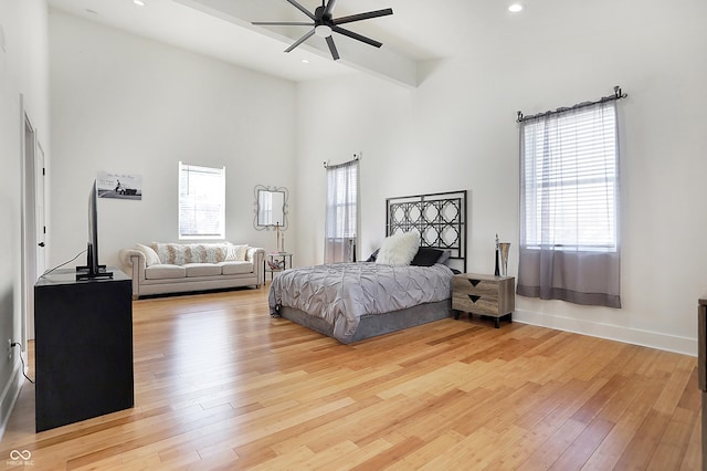 1209 N Rural St, Indianapolis, IN 46201 - bedroom with beam ceiling, a high ceiling, recessed lighting, and light wood-type flooring
