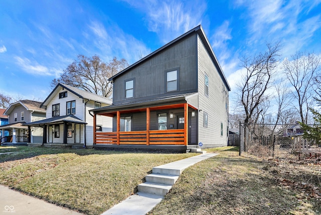 contemporary house featuring a porch, fence, and a front yard