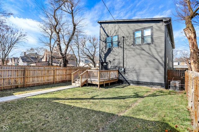 1209 N Rural St, Indianapolis, IN 46201 - rear view of house featuring a deck, a yard, and a fenced backyard