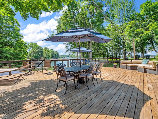 deck with an outdoor living space and outdoor dining area