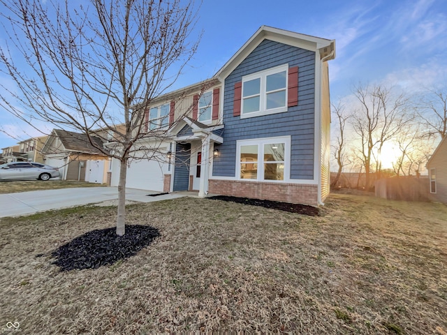 traditional home with brick siding and driveway