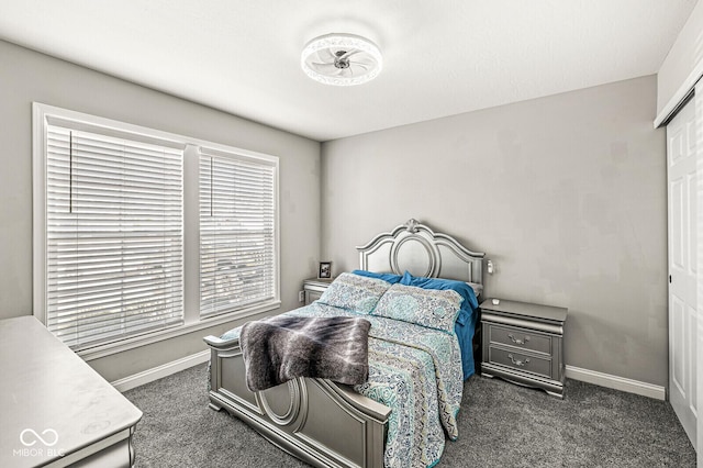 bedroom featuring baseboards and carpet floors