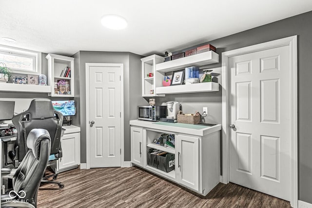 office space with dark wood-style floors