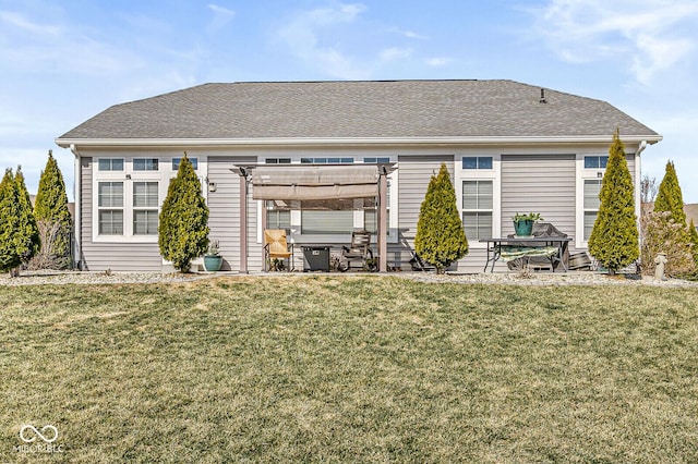 rear view of house featuring a yard, a patio area, and a pergola