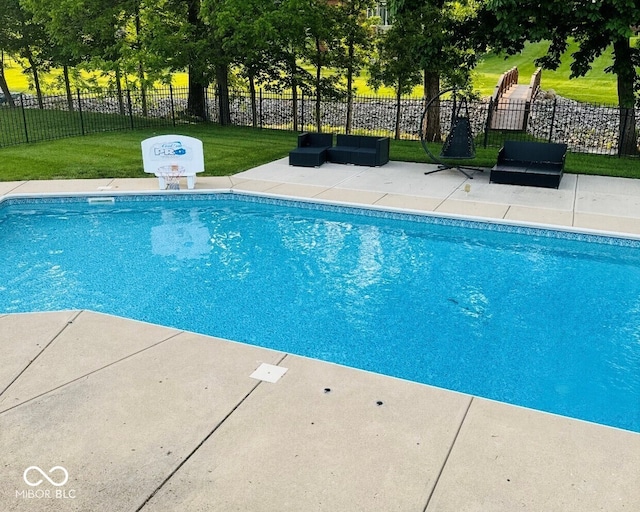 view of pool featuring a fenced in pool, a patio, a yard, and fence