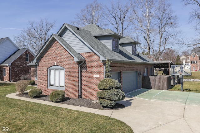 view of home's exterior with brick siding, a lawn, concrete driveway, and roof with shingles