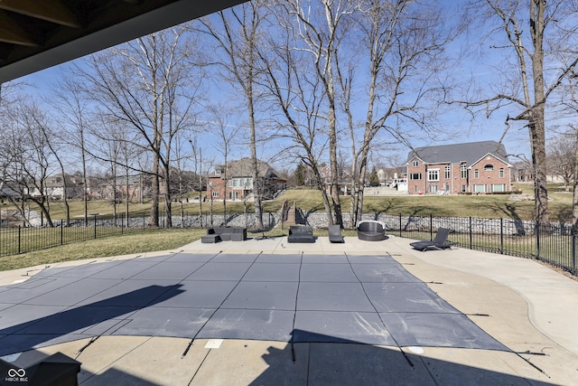 view of pool featuring a residential view, fence, a lawn, and a patio area