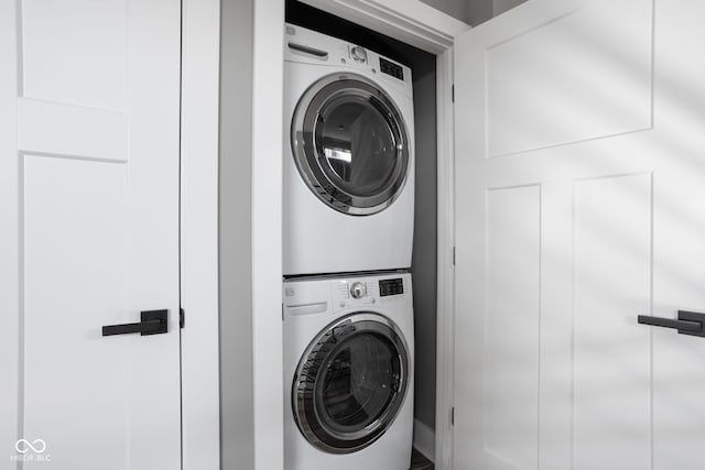 washroom with laundry area and stacked washing maching and dryer