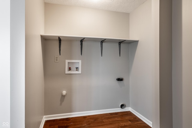 laundry area with laundry area, hookup for a washing machine, baseboards, and dark wood-style flooring