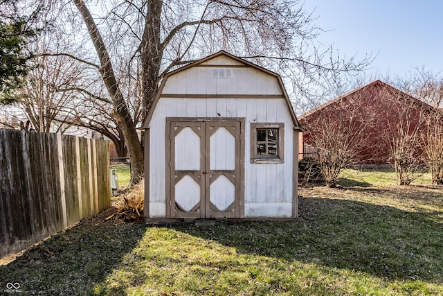 view of shed with fence