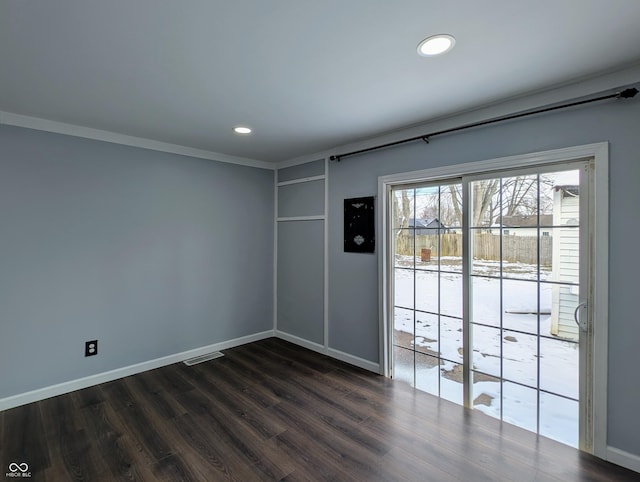 empty room with dark wood finished floors, visible vents, recessed lighting, and baseboards