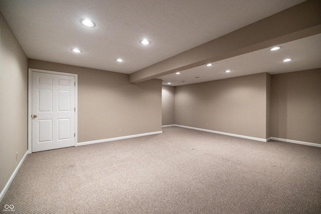 finished below grade area featuring carpet flooring, recessed lighting, and baseboards