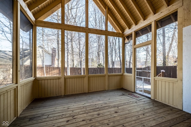 unfurnished sunroom with wooden ceiling and vaulted ceiling