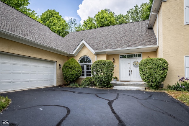 12348 Seaway Cir, Indianapolis, IN 46236 - view of front of house with brick siding, a shingled roof, and driveway