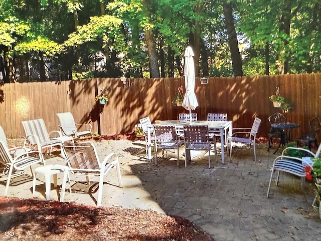 12348 Seaway Cir, Indianapolis, IN 46236 - fenced backyard featuring a patio and outdoor dining area