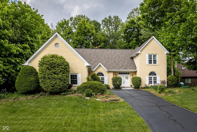 12348 Seaway Cir, Indianapolis, IN 46236 - traditional-style home with a shingled roof, a front yard, and driveway