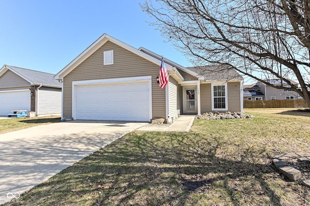 view of front of house with a front yard, fence, a garage, and driveway