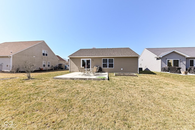 back of house with a lawn and a patio area