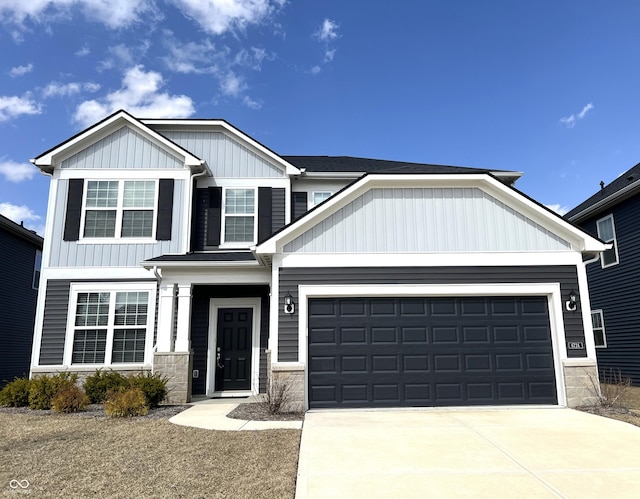 craftsman house with a garage, board and batten siding, and concrete driveway