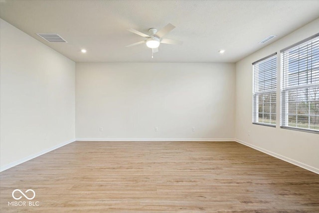 spare room with visible vents, baseboards, ceiling fan, recessed lighting, and light wood-style flooring
