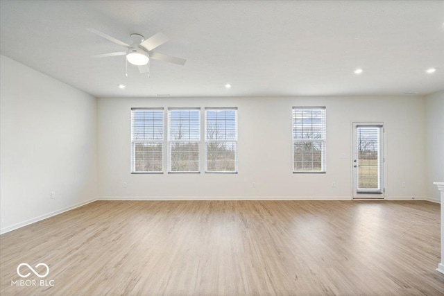 spare room with recessed lighting, baseboards, a ceiling fan, and wood finished floors
