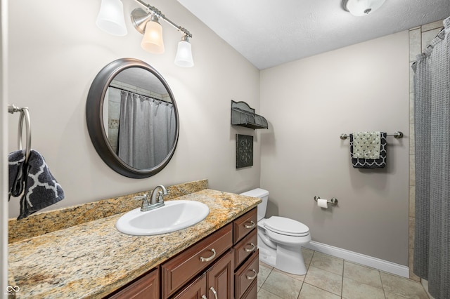 full bathroom featuring baseboards, toilet, a shower with shower curtain, tile patterned floors, and vanity