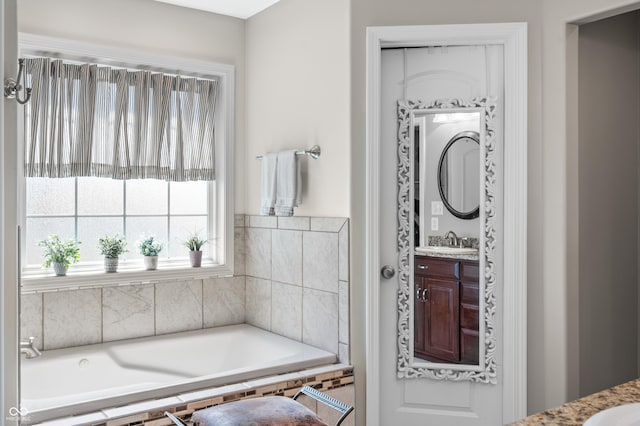 bathroom with a bath and vanity