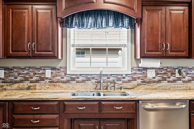 kitchen with a sink, decorative backsplash, light stone counters, and dishwasher