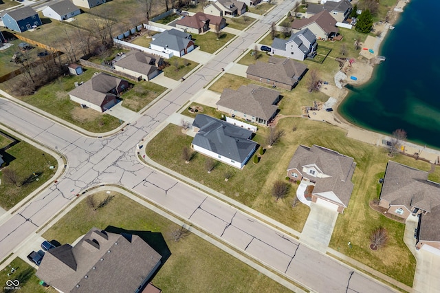 birds eye view of property featuring a residential view and a water view