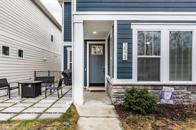 property entrance featuring a patio