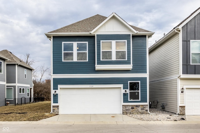 view of front of property featuring stone siding, concrete driveway, an attached garage, and a shingled roof