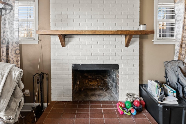 details with a brick fireplace