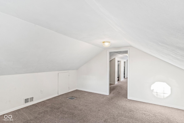 bonus room featuring vaulted ceiling, carpet, visible vents, and baseboards