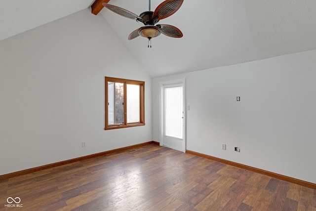 unfurnished room with beam ceiling, high vaulted ceiling, baseboards, and wood finished floors