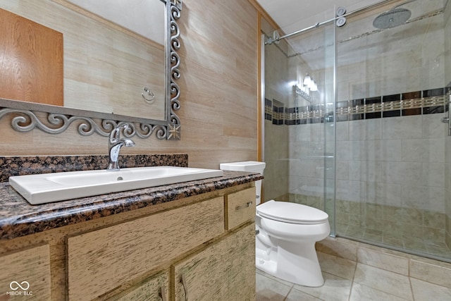 full bathroom with tile patterned floors, a stall shower, toilet, and vanity