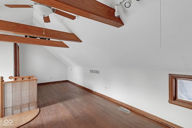 bonus room featuring wood finished floors, vaulted ceiling with beams, baseboards, and visible vents