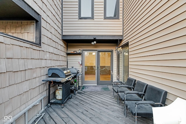 wooden deck featuring area for grilling