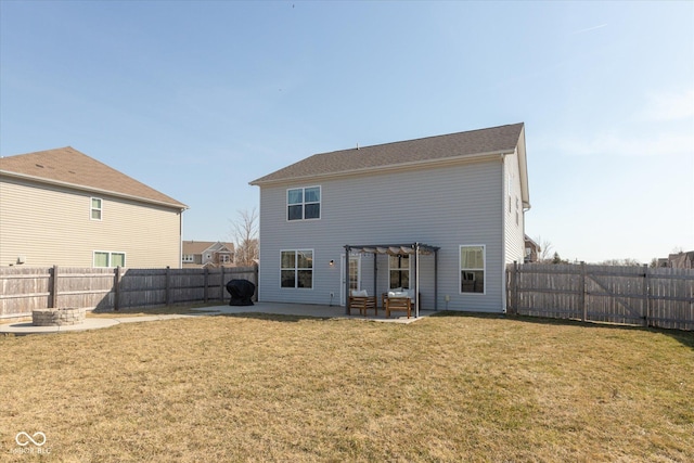 back of property with a patio area, an outdoor fire pit, a pergola, and a yard