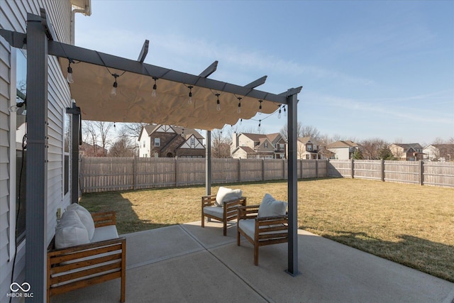 view of patio with a fenced backyard and a residential view