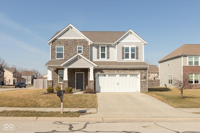 craftsman-style house with stone siding, driveway, an attached garage, and a front yard