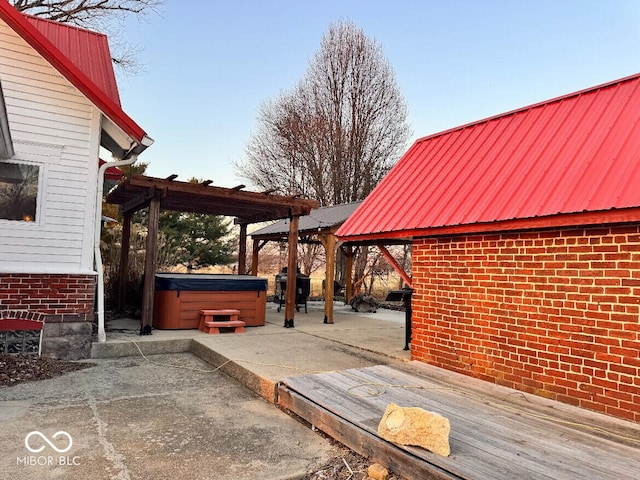 view of patio featuring area for grilling and a hot tub