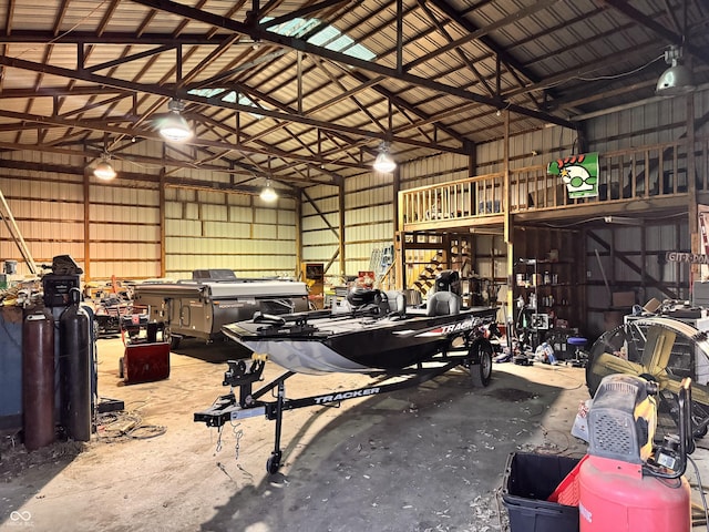 garage featuring a workshop area and metal wall