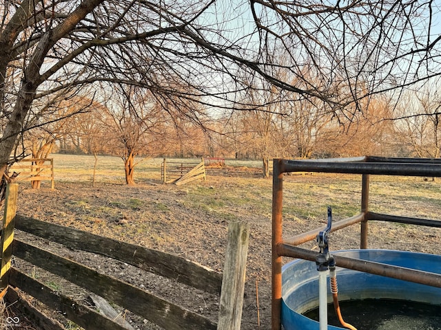 view of yard with a rural view