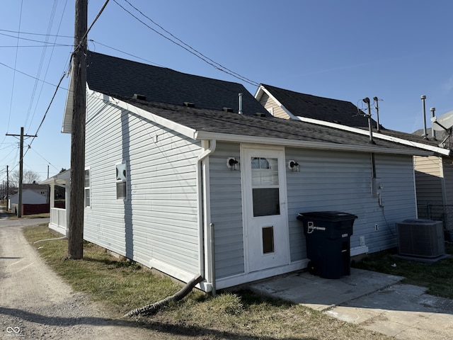 view of side of property featuring central AC