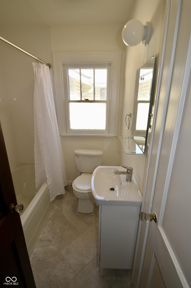 full bath featuring tile patterned flooring, toilet, vanity, and shower / tub combo