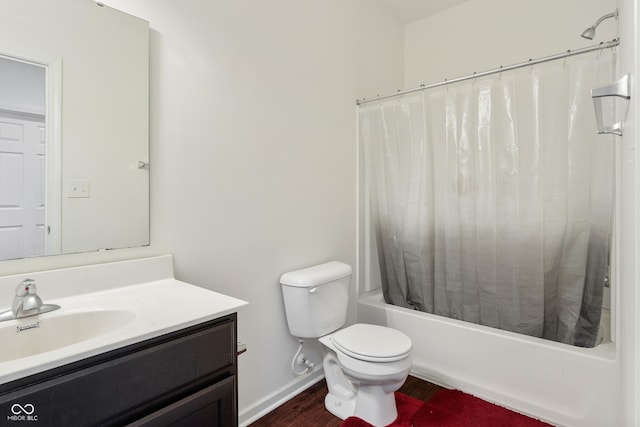 full bath featuring vanity, wood finished floors, baseboards, toilet, and shower / tub combo with curtain