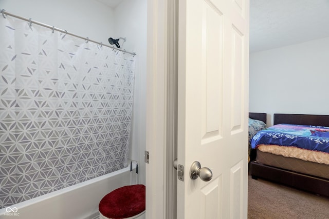 ensuite bathroom featuring shower / bathtub combination with curtain and ensuite bath