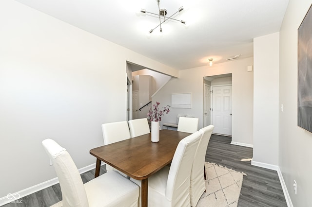 dining area featuring dark wood-style floors and baseboards